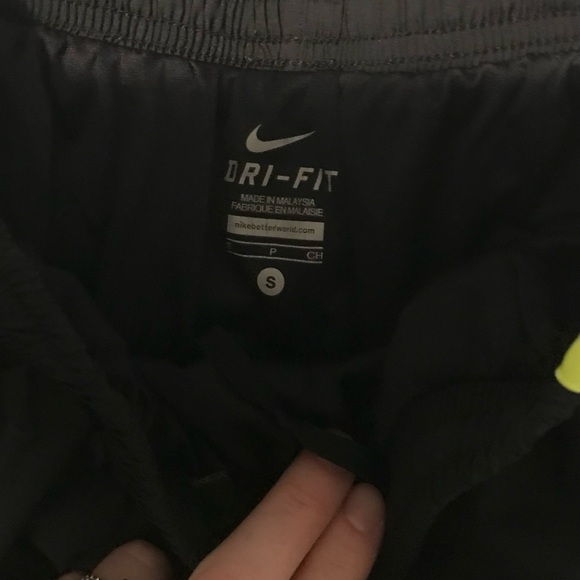 Small black Nike running shorts with highlighter yellow and dark purple. - Picture 2 of 3